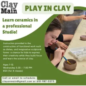 Child learning ceramics in a studio setting.